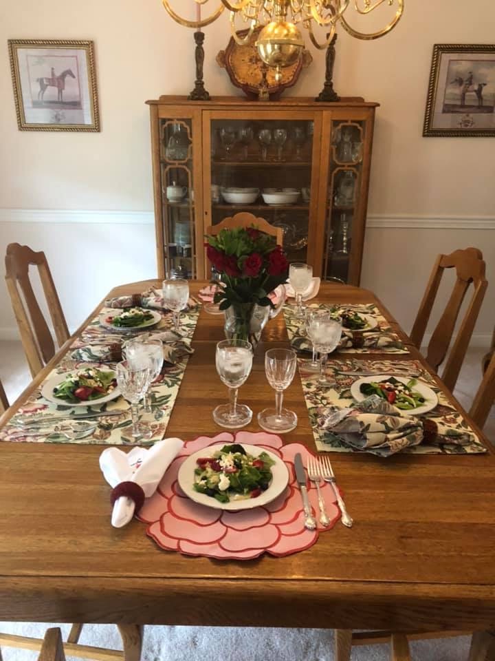 Elegantly set dining table prepared for a social dinner party