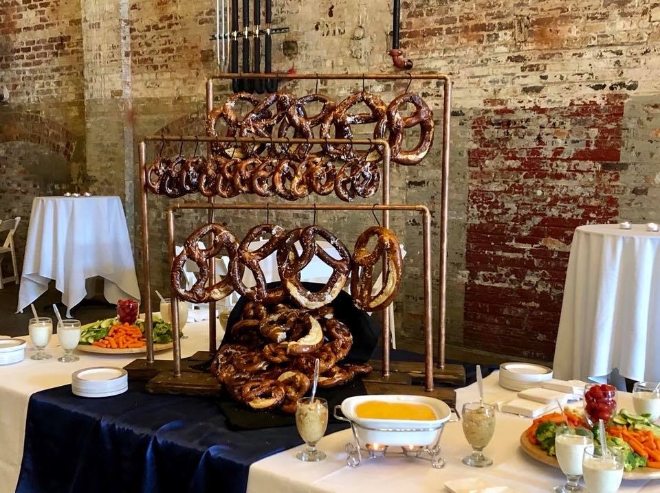Catering pretzel wall display at a wedding reception