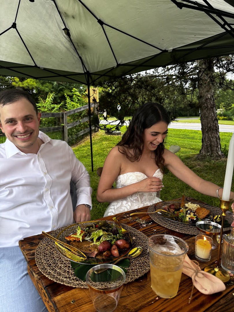 Bride and groom at an outdoor catered event